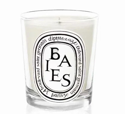 Baies scented candle in a glass jar on white background
