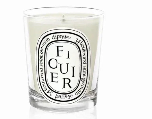 Figuier scented candle in a  glass jar on white background